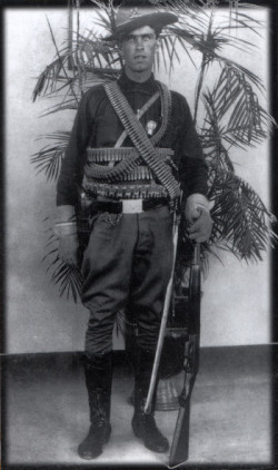 Emil Holmdahl, a native of Fort Dodge, epitomized the stereotype of a soldier of fortune in his mercenary regalia. Photo courtesy of the Holmdahl Papers.