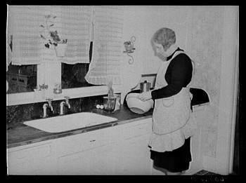 The wife of an Iowa farmer in Greene County, captured in this photo from April 1940, starts to make a cake. Photo courtesy of the Library of Congress, LC-USF34-060756-D.