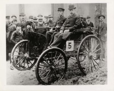 The winning car of the 1895 Chicago Times-Herald race, the Duryea Motorized Wagon, shown here on the occasion of the famous event. The Duryea car had a one-cylinder internal-combustion engine. Photographer unknown, Detroit Public Library Digital Collections
